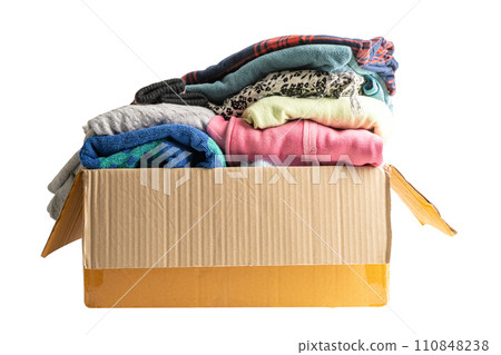 Donation box with used clothes isolated on white background with clipping path to support help for poor people in the world. 110848238