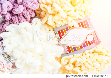 Fluffy yarn. Colored threads in reels. Knitting hobby embroidery Fluffy yarn. Colored threads in reels. Knitting hobby embroidery 110848345