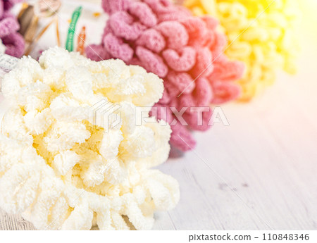 Fluffy yarn. Colored threads in reels. Knitting hobby embroidery Fluffy yarn. Colored threads in reels. Knitting hobby embroidery 110848346