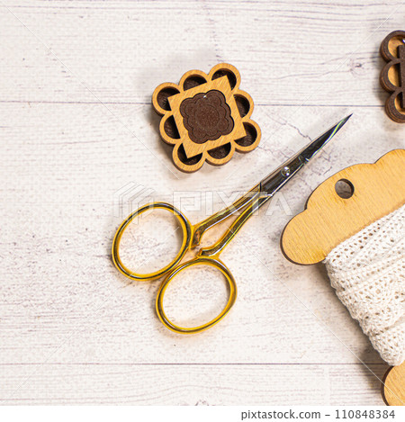 Accessories for hobby. Hoop snaps, threads, needles and scissors. Vintage tools for embroidery and knitting 110848384