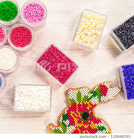 Colorful glass beads. Variety of shapes and colors to make a bead necklace or a string of beads for women Colorful glass beads. Variety of shapes and colors to make a bead necklace or a string of beads for women 110848391