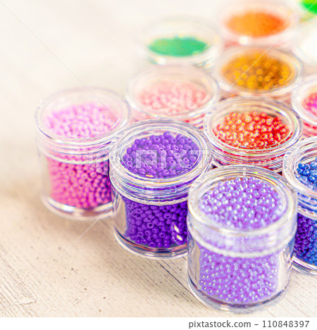 Colorful glass beads. Variety of shapes and colors to make a bead necklace or a string of beads for women Colorful glass beads. Variety of shapes and colors to make a bead necklace or a string of beads for women 110848397
