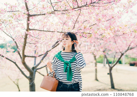 Cherry blossoms and a young woman Cherry blossoms and a young woman 110848768