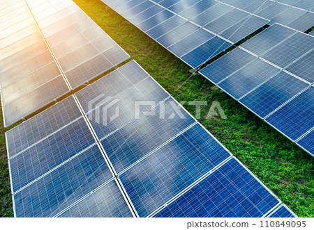 Solar farm and sun light. Solar power for green energy. Sustainable renewable energy. Photovoltaic power station or solar park. Solar panel installation and maintenance concept. Energy sustainability. 110849095