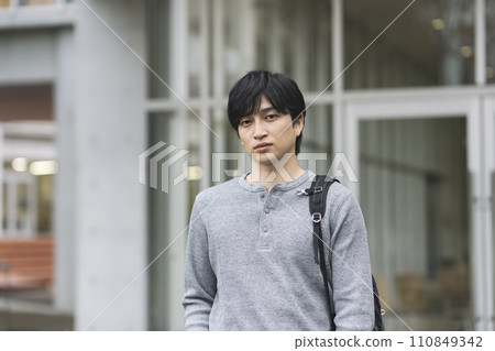 Young man looking at camera, college student image portrait 110849342