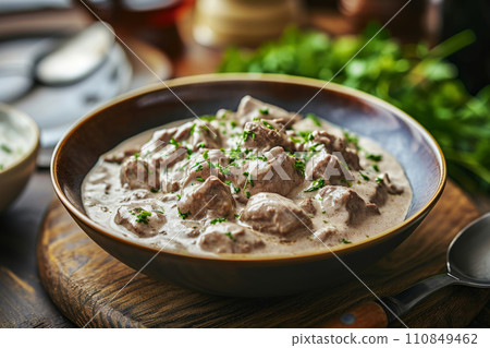 Creamy beef stroganoff with fresh greenery. Generative AI 110849462