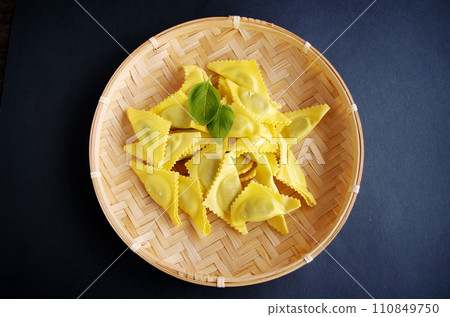 Ravioli pasta dish Italy on a bamboo plate Ravioli pasta dish Italy on a bamboo plate 110849750
