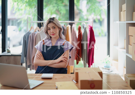 Portrait Of Asian Female Owner Of Fashion Store Clothing Store successful happy smile at small business, sme or ecommerce concepts. Portrait Of Asian Female Owner Of Fashion Store Clothing Store successful happy smile at small business, sme or ecommerce concepts. 110850325