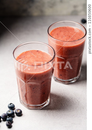 Berry smoothie, fresh blueberry, raspberry, strawberry smoothie in a glass.  110850600