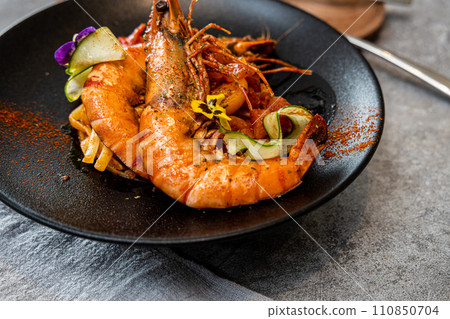 Giant tiger prawns with lemon and pickled cucumber Giant tiger prawns with lemon and pickled cucumber 110850704
