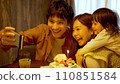 A family taking a selfie to commemorate their birthday 110851584