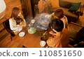 Three-generation family dining table/Gathering together over hot pot dishes (overhead view) 110851650