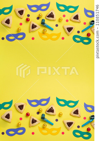 Hamantaschen Cookies for Purim Celebration on Yellow Background 110851746