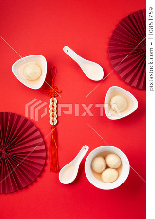Chinese Lunar New Year Concept. Sweet Rice Dumplings Balls Tangyuan on Red Table 110851759