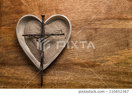 Ash wednesday, crucifix made of ash, dust as christian religion. Lent beginning 110852367