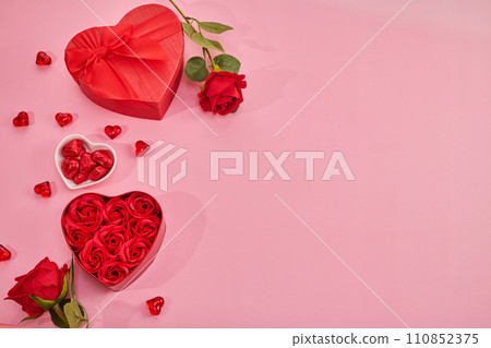 Gift box with beautiful red ribbon and roses, concept of Valentine's, anniversary, mother's day Gift box with beautiful red ribbon and roses, concept of Valentine's, anniversary, mother's day 110852375