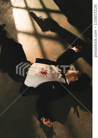 man in suit shot 110853226