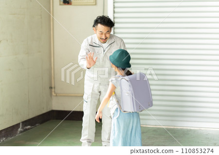 A father seeing off his elementary school daughter going to school A father seeing off his elementary school daughter going to school 110853274