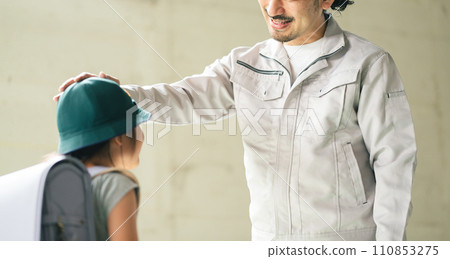 A father seeing off his elementary school daughter going to school A father seeing off his elementary school daughter going to school 110853275