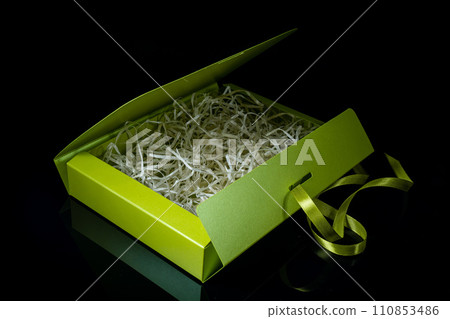 Man gift concept. gift box with luxury bow on dark background. Horizontal with copy space. Man gift concept. gift box with luxury bow on dark background. Horizontal with copy space. 110853486