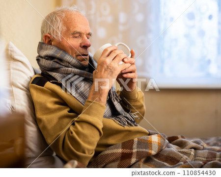 Elderly Senor Treated For Cold With Hot Tea At Home 110854430