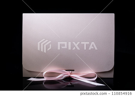 Man gift concept. gift box with luxury bow on dark background. Horizontal with copy space. 110854916