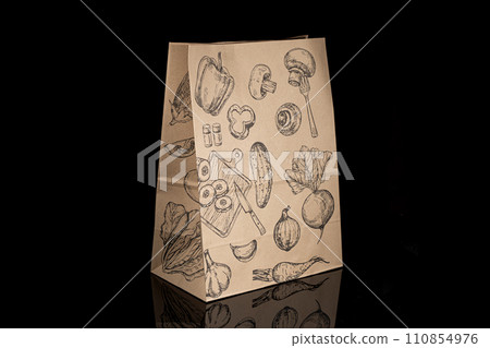 Recyclable craft paper bag for purchases, gifts and takeaway food mock up on black background. Environmentally friendly than single-use plastic bags 110854976