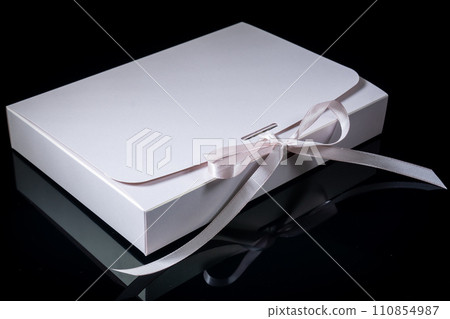 Man gift concept. gift box with luxury bow on dark background. Horizontal with copy space. 110854987