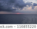 Sunset over the mediterranean sea on a cloudy day 110855220