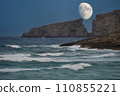 Moon rising between the cliffs of a Mediterranean beach 110855221