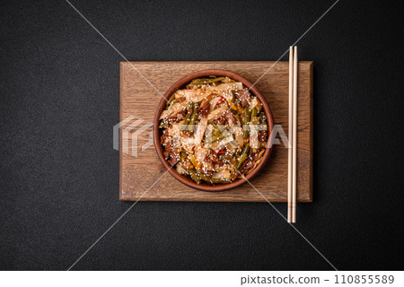 Delicious Asian dish udon with hot peppers, green beans, spices and herbs 110855589