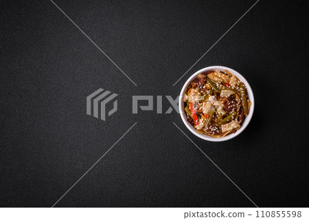 Delicious Asian dish udon with hot peppers, green beans, spices and herbs 110855598