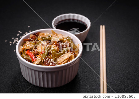 Delicious Asian dish udon with hot peppers, green beans, spices and herbs 110855605