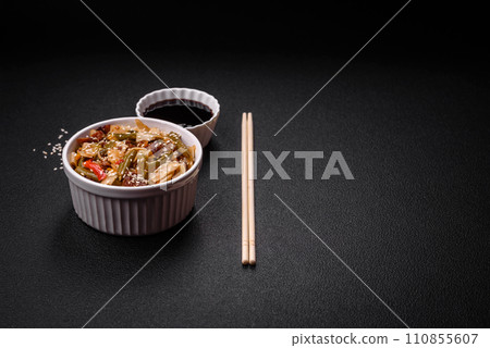 Delicious Asian dish udon with hot peppers, green beans, spices and herbs 110855607
