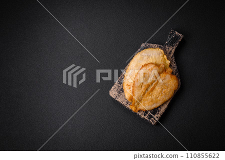 Delicious battered chicken breast chops with salt, spices and herbs 110855622
