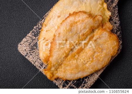 Delicious battered chicken breast chops with salt, spices and herbs Delicious battered chicken breast chops with salt, spices and herbs 110855624