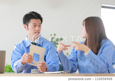 Mechanical engineers (male and female) discussing the designed aluminum cutting products_1 Mechanical engineers (male and female) discussing the designed aluminum cutting products_1 110856408