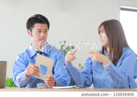 Mechanical engineers (male and female) discussing the designed aluminum cutting products_2 Mechanical engineers (male and female) discussing the designed aluminum cutting products_2 110856409