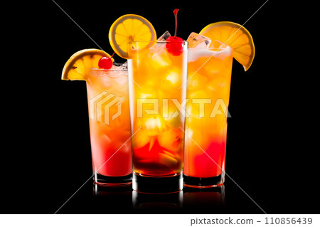 Set of Tequila Sunrise cocktail blend of tequila, orange juice, and grenadine on black 110856439