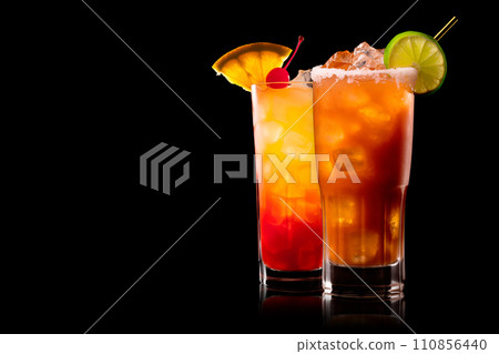 Set of Michelada cocktail in beer glass featuring with beer, lime juice, tomato juice, spicy sauce and spices on black. Set of Michelada cocktail in beer glass featuring with beer, lime juice, tomato juice, spicy sauce and spices on black. 110856440