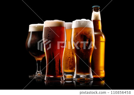 Set of Beer glasses and bottles on a black background. Mugs with drink like Ipa, Pale Ale, Pilsner, Porter or Stout 110856458