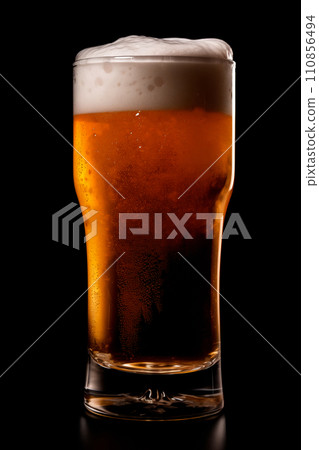 Beer in a tall glass on a dark black background. Mugs with drink like Ipa, Pale Ale, Pilsner, Porter or Stout Beer in a tall glass on a dark black background. Mugs with drink like Ipa, Pale Ale, Pilsner, Porter or Stout 110856494