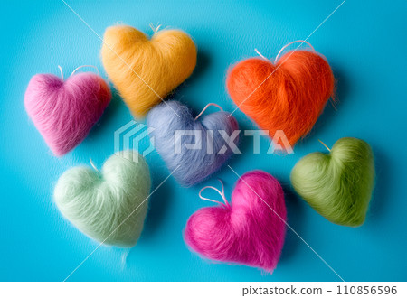Poster or banner of colorful yarn hearts on surface on a blue background, Vibe of st. Valentine day and romantic Poster or banner of colorful yarn hearts on surface on a blue background, Vibe of st. Valentine day and romantic 110856596