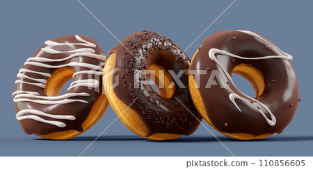 A pile of chocolate glazed donuts with sprinkles in motion falling on a grey A pile of chocolate glazed donuts with sprinkles in motion falling on a grey 110856605