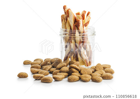 Dog food. Snack sticks for dogs in jar isolated on white background. 110856618
