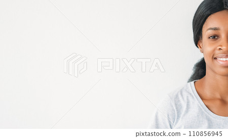 Positive attitude. Optimistic lifestyle. Cheerful confident satisfied woman half face with happy smile in good mood isolated on white background empty space. 110856945