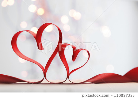 Hearts made from red ribbon. Valentine's card Hearts made from red ribbon. Valentine's card 110857353