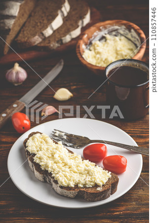 Rye bread toast with processed cheese and garlic 110857446