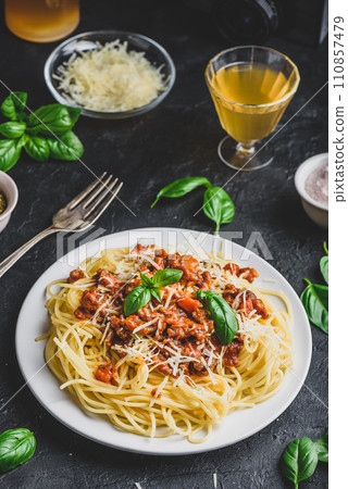 Spaghetti with bolognese sauce, parmesan and basil Spaghetti with bolognese sauce, parmesan and basil 110857479