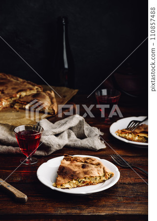 Slice of cabbage pie on white plate Slice of cabbage pie on white plate 110857488